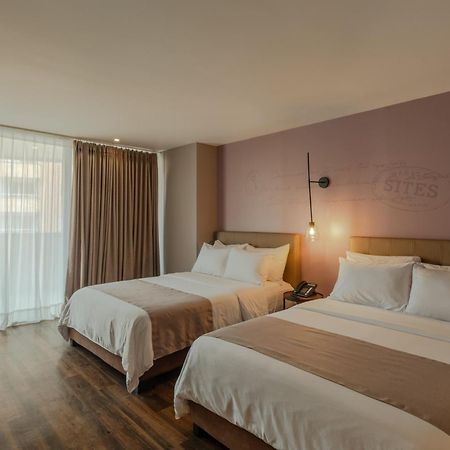 Sites Hotel Medellin Exterior photo A room at the hotel